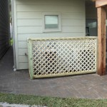 Treated wood lattice panels next to home n back yard