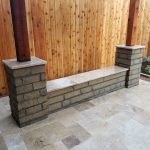 Stone sitting bench with travertine top