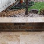 Stone, Choprock & travertine columns and sitting bench in back yard