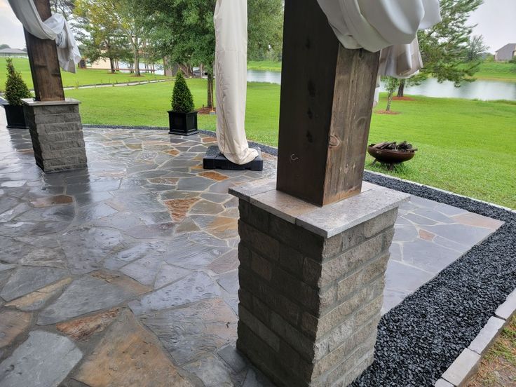 Charcoal chop rock column capped with Nordic silver stone