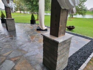 Charcoal chop rock capped with Nordic silver travertine