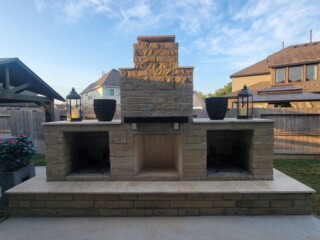 Llano chop rock fireplace with wood storage and benches, light blend travertine tops