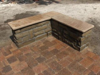 Oklahoma chop rock bench with buckskin flagstone tops. Bergerac series paver patio