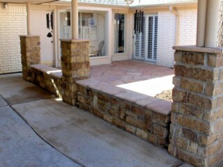 Oklahoma chop rock wall and columns, capped with arizona buckskin tops.