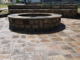 Oklahoma chop rock firepit with paver patio and sitting bench