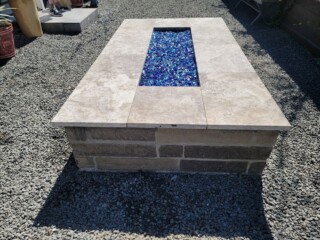 Charcoal chop rock, capped with Nordic silver travertine