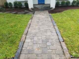 Cambridge cobble pavers with Oklahoma chop rock borders