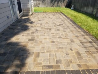 Cambridge cobble series, Danville beige color, holland stone soldier course perimeter charcoal color