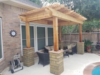 Cedar pergola with choprock columns
