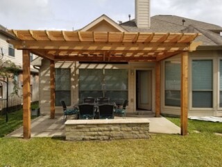 Cedar pergola with stone sitting bench