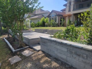 Charcoal color choprock, capped with silver mist flagstone