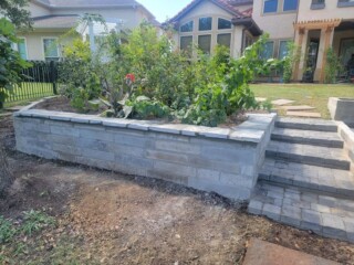 Charcoal color choprock, capped with silvermist flagstone