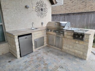 Cream colored limestone chop rock, capped with light travertine tops