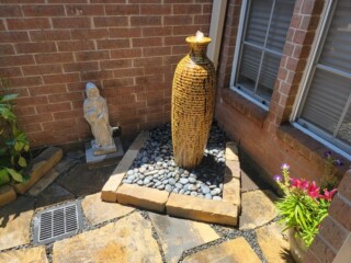 Disappearing ceramic jar water feature