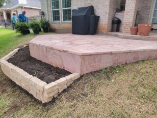 Elevated Arizona pink flagstone patio with planter