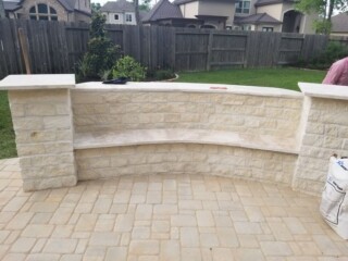 Limestone chop rock with back wall capped with light travertine