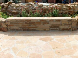 Moss rock stone capped with flagstone