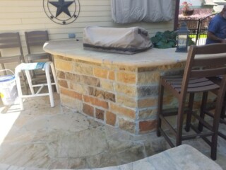 Moss rock stone, capped with flagstone