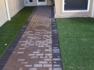 Red holland pavers with charcoal soldier course