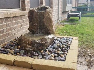 Stone disappearing water feature