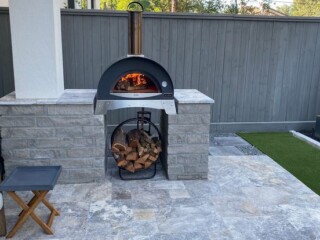 Charcoal color chop rock capped with Nordic silver travertine
