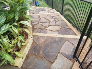 Oklahoma flagstone with granite gravel joints, treated timbers